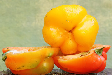 The beauty and freshness of freshly picked bell pepper fruits. This plant has the scientific name Capsicum annuum var. grossum.