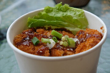 chicken katsu rice bowl. Chicken Katsu also known as panko chicken or tori katsu is a Japanese dish, consisting of fried chicken made with panko bread crumbs. Japanese food.