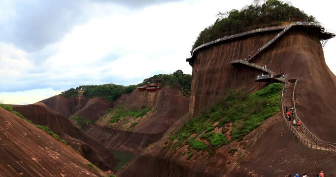 Time lapse of Gaoyi Ridge Danxia landform.Gaoyi Ridge(Gaoyiling) Scenic Area is located in Chenzhou City of Hunan Province, which is dominated by Danxia landform. The peaks of Gaoyi Ridge are steep 