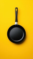 Cooking Action Black Frying Pan on Vibrant Yellow Background Kitchen Utensil Minimalist Style