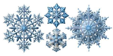 four intricate snowflakes with unique patterns cut out
