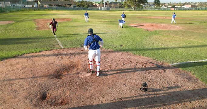 Celebrating victory, baseball team jumping and cheering on field after game