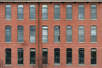 facade view of brick wall and window of old factory building