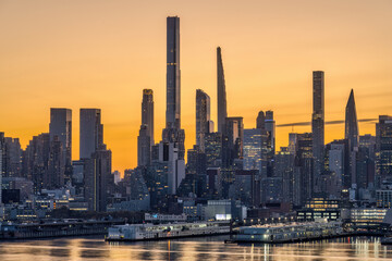 The skyline of Midtown Manhattan in New York before sunrise with the pencil towers of  Billionaires...