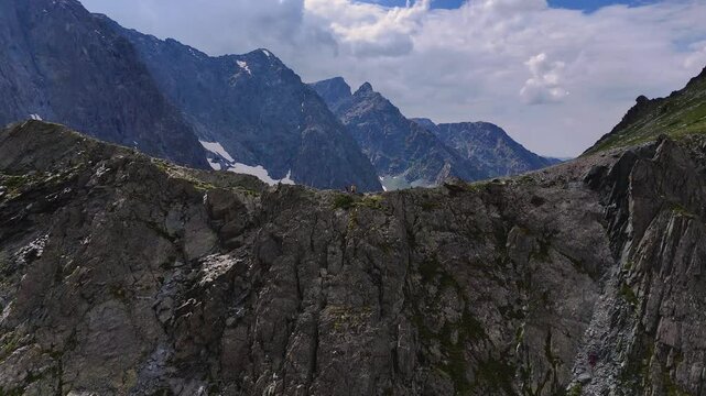 two tourists on the Kuyguk pass in summer in Altai