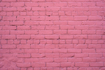 Background from a wall made of pink painted bricks