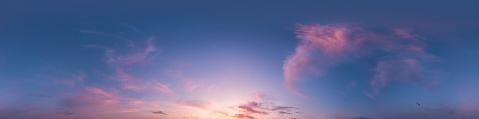 Sunset sky with bright glowing pink Cirrus clouds. Seamless spherical HDR 360 panorama. Full zenith or sky dome in 3D, sky replacement for aerial drone panoramas. Climate and weather change. © panophotograph
