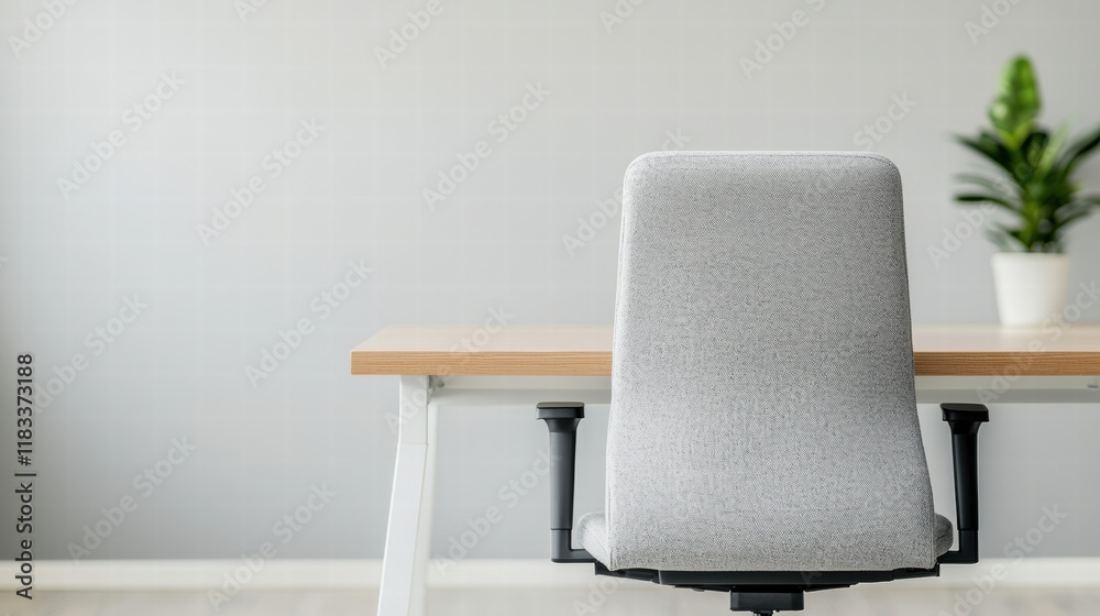 Poster ergonomic chair inviting to sit at an empty desk in a modern office