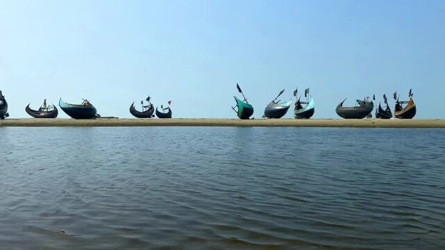 Coxbazae fishing boat, Moon boats, Traditional Bangladeshi moon boats resting along the shores of Inani Beach, Cox's Bazar, Bangladesh