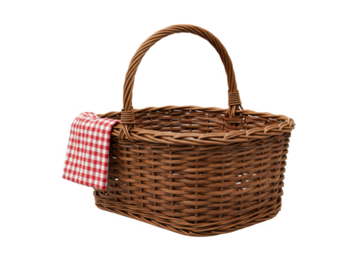 Rustic wicker basket with a curved handle and a red and white checkered cloth draped over the side, isolated on white background
