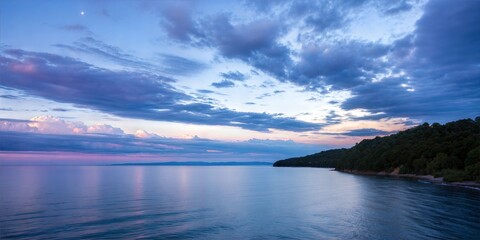 Obraz premium Panorama of sea sunrise, ocean sunrise, seascape. Romantic colorful sunset at the sea. The sun touches horizon.