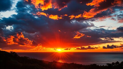 Fototapeta premium Majestic burning skies create a stunning sunset in this paradise, showcasing the vibrant colors of nature s beauty during the evening, perfect for those seeking a serene and picturesque scene.