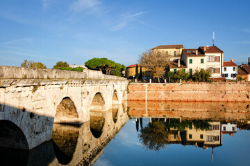 Obraz premium Morning view to Bridge of Tiberius in Rimini, Italy. Constructed between 14 and 21 AD. Copy space in sky.