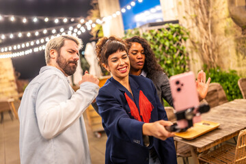 Vlogger streaming online during party with friends