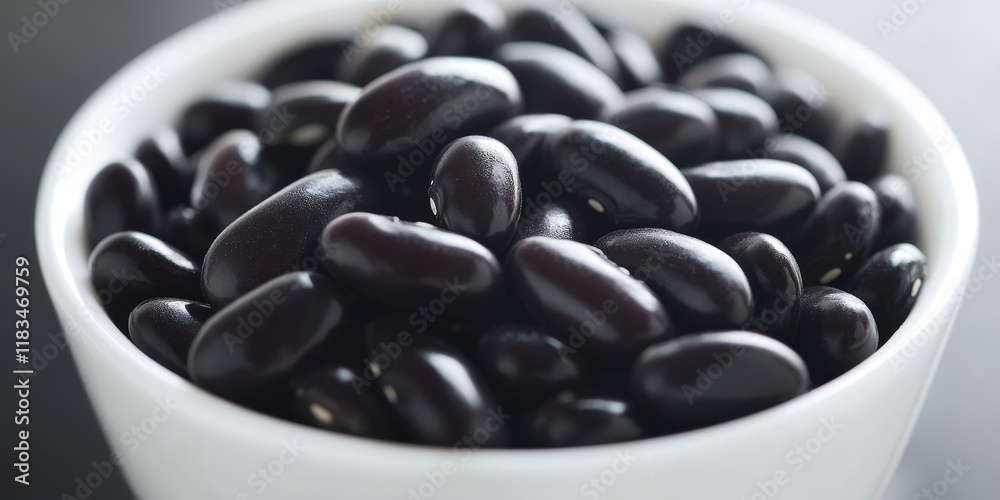 Poster a close up view of black kidney beans arranged neatly in a white bowl, highlighting the contrast and