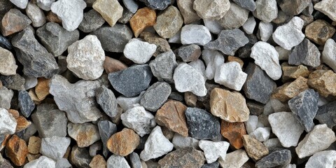 Small granite white and gray gravel pieces scattered over a brown ground surface create a textured and natural appearance. This small granite gravel adds contrast and interest to any environment.