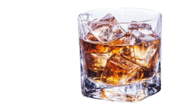 Glass of whiskey with ice cubes, isolated on white background. PNG transparent.
