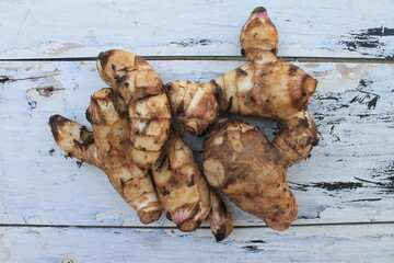 A typical Indonesian food is a type of tuber called midra on a wooden table



