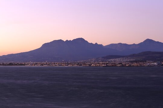 Scenic View of Gordon's Bay with Majestic Mountains at Sunset in Cape Town, South Africa