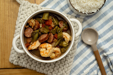 A bowl of gumbo served with rice
