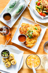 Asian and Thai dishes, including spring rolls, wontons, and dumplings.