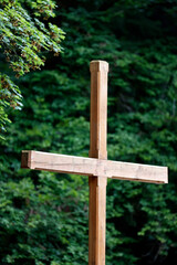 Wooden cross in nature. Christian symbol. Faith and spirituality.