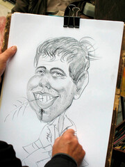  Cartoonist making a caricature of a man.