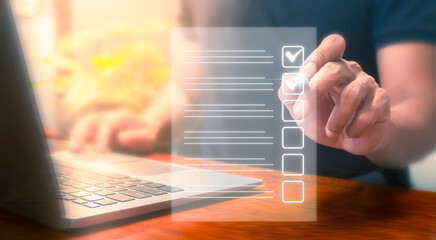 Business man using laptop checklist survey, Filling out digital checklist, Questionnaire with...