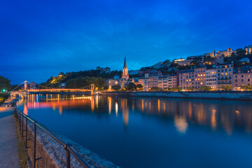 Beautiful scenic view of Lyon, France, at night with the River Saone
