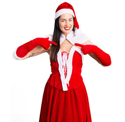 Young beautiful caucasian woman wearing santa claus costume looking confident with smile on face,...