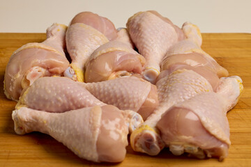 chicken legs on a wooden table
