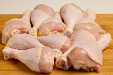 chicken legs on a wooden table