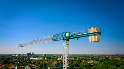 The upper part of construction tower crane with counterweights