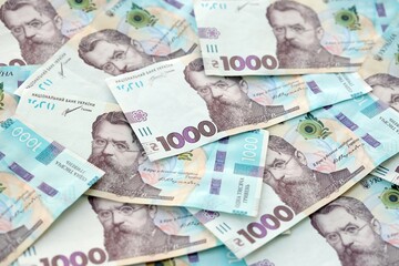 Big amount of ukrainian new one hundred hryvnia money bills with modern design. Financial concept, business