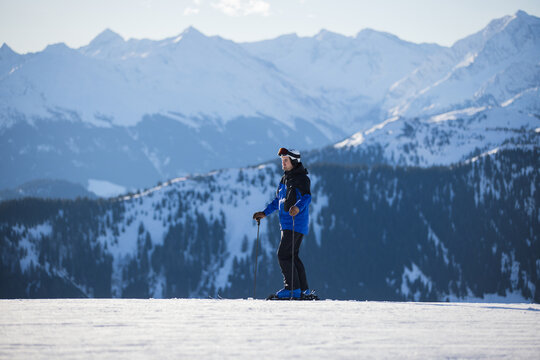 Skier on snowy slopes with majestic Kitzb&uuml;hel alpine backdrop