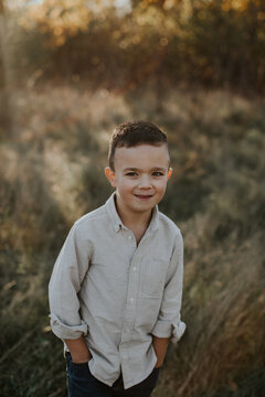 Portrait of handsome five year old boy with hands in his pockets