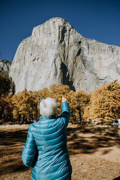 Elderly woman looks in awe at El Capitan, Yosemite National Park