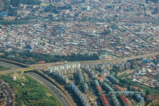Modern housing (bottom) near the Kibera slum (top) in Nairobi.