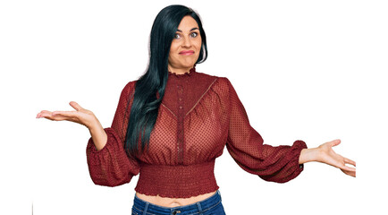 Young caucasian woman wearing casual clothes clueless and confused expression with arms and hands...