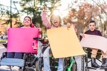 AccelerateAction Disabled women holding protest signs and claiming rights