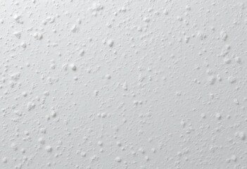 White textured wall surface detail showing subtle bumps