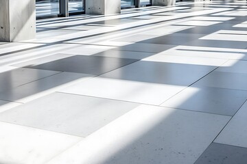 Obraz premium Sunlight streams through modern office windows onto geometric floor tiles