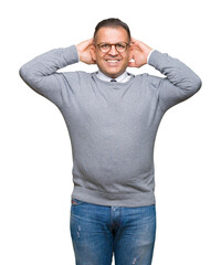 Fototapeta premium Middle age bussines arab man wearing glasses over isolated background Relaxing and stretching with arms and hands behind head and neck, smiling happy