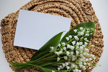 spring postcard layout with a bouquet of lilies of the valley