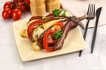 Baked tomato with mozzarella and tomato