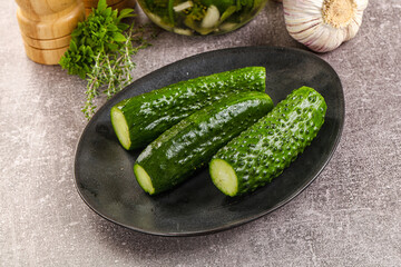 Homemade lighty salted cucumbers with herbs