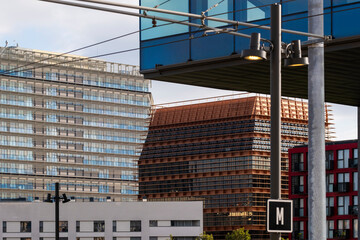 This cityscape image highlights modern architectural styles, showcasing a blend of materials and design while emphasizing urban life and contemporary aesthetics in Poblenou in Barcelona Spain