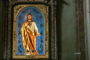 Sacred Heart of Jesus statue in a religious setting.