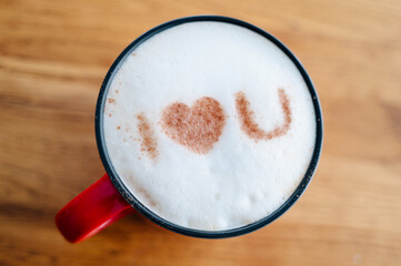 cup of cappuccino with the inscription on the milk foam I love you, Valentine's Day