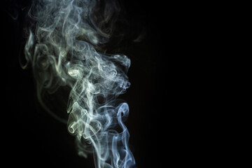 Swirling white smoke against a dark background creates a mysterious and captivating effect